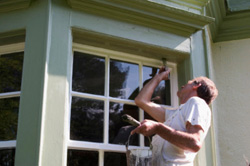Handyman doing exterior House Painting